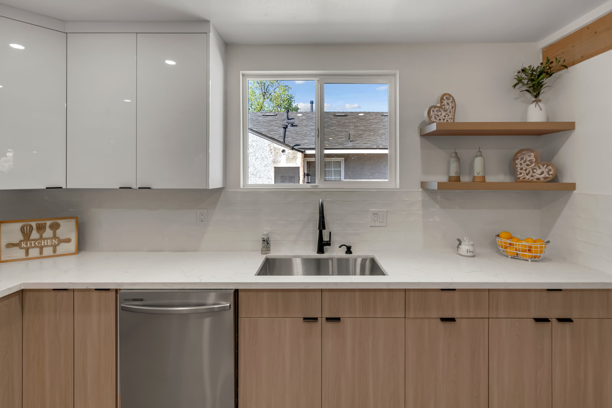 Kitchen with floating shelves and modern cabinetry