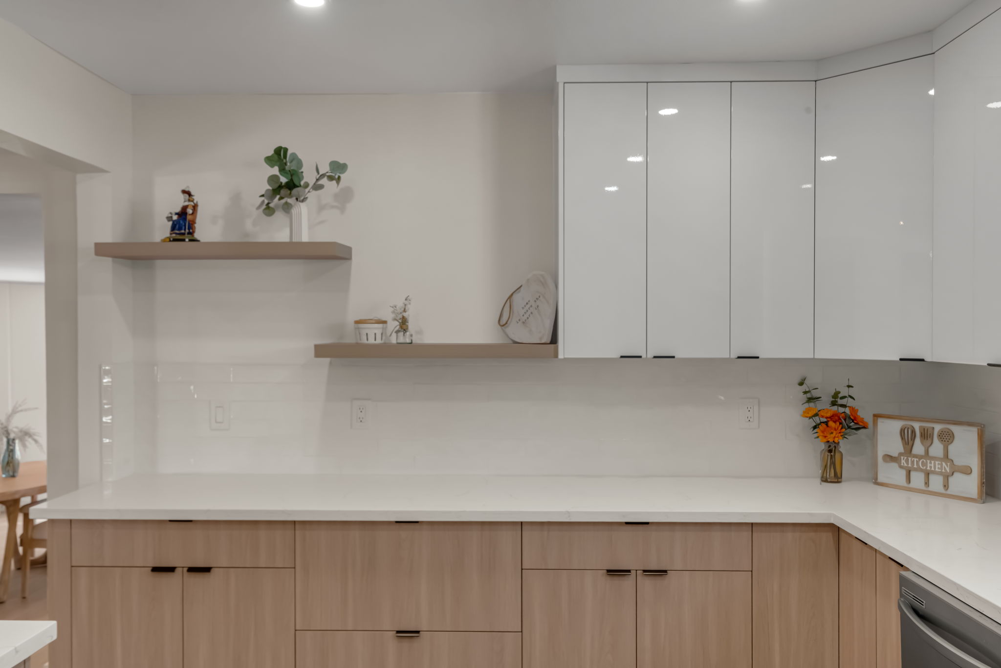 Kitchen dining area with exposed beam and pendant lights