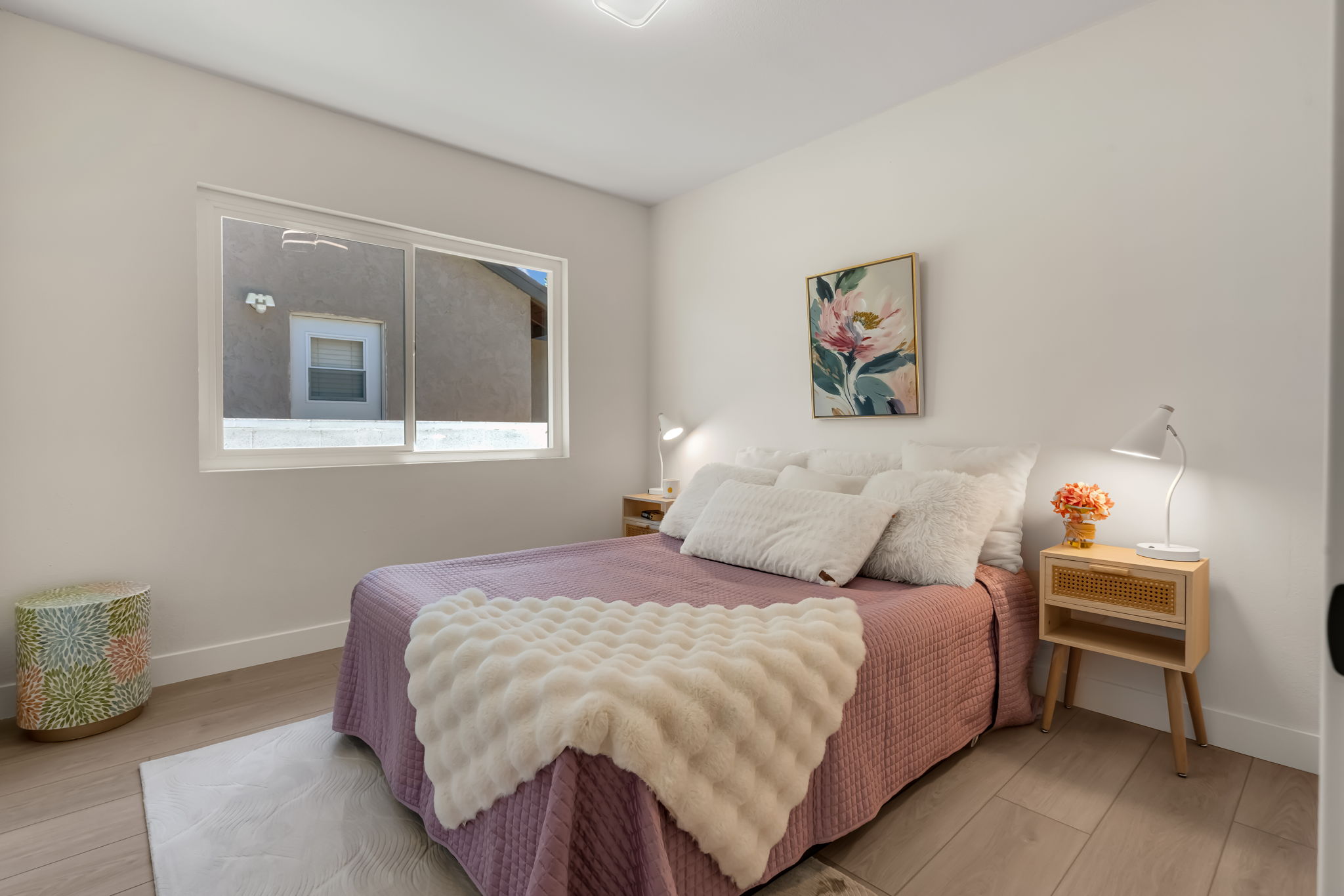 Primary bedroom with upholstered headboard
