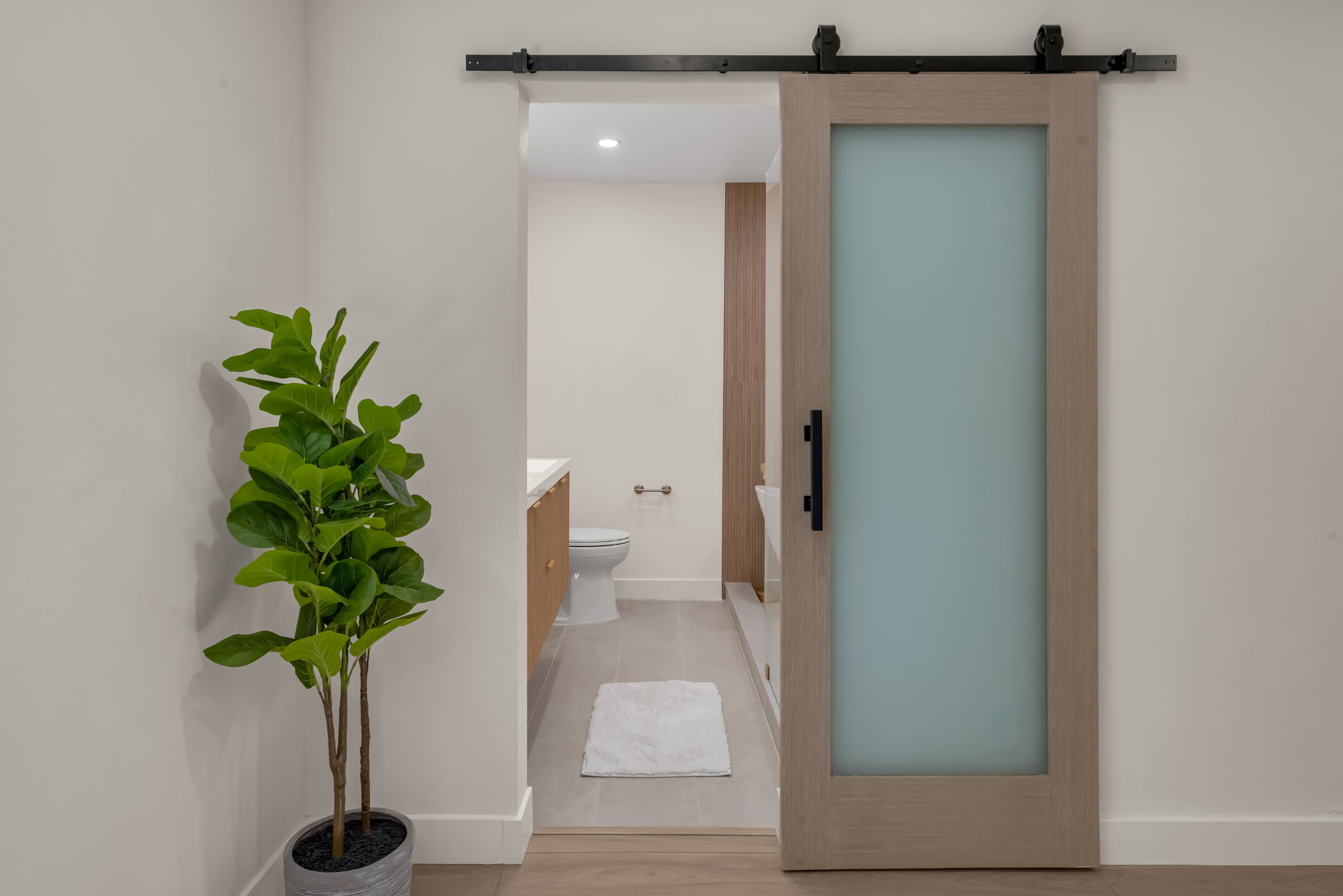 Primary bathroom mirror and fixtures detail