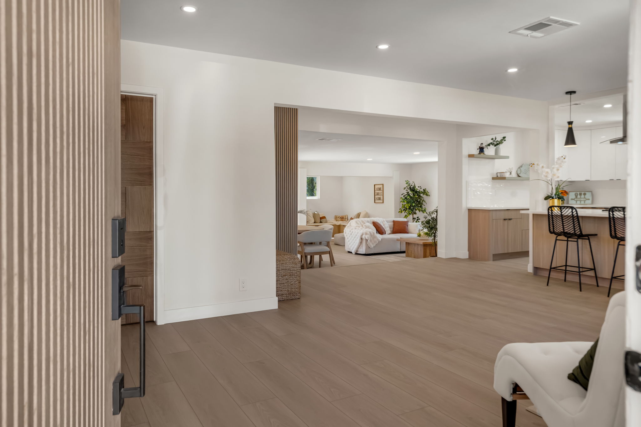 Open floor plan entry — view into living room and kitchen