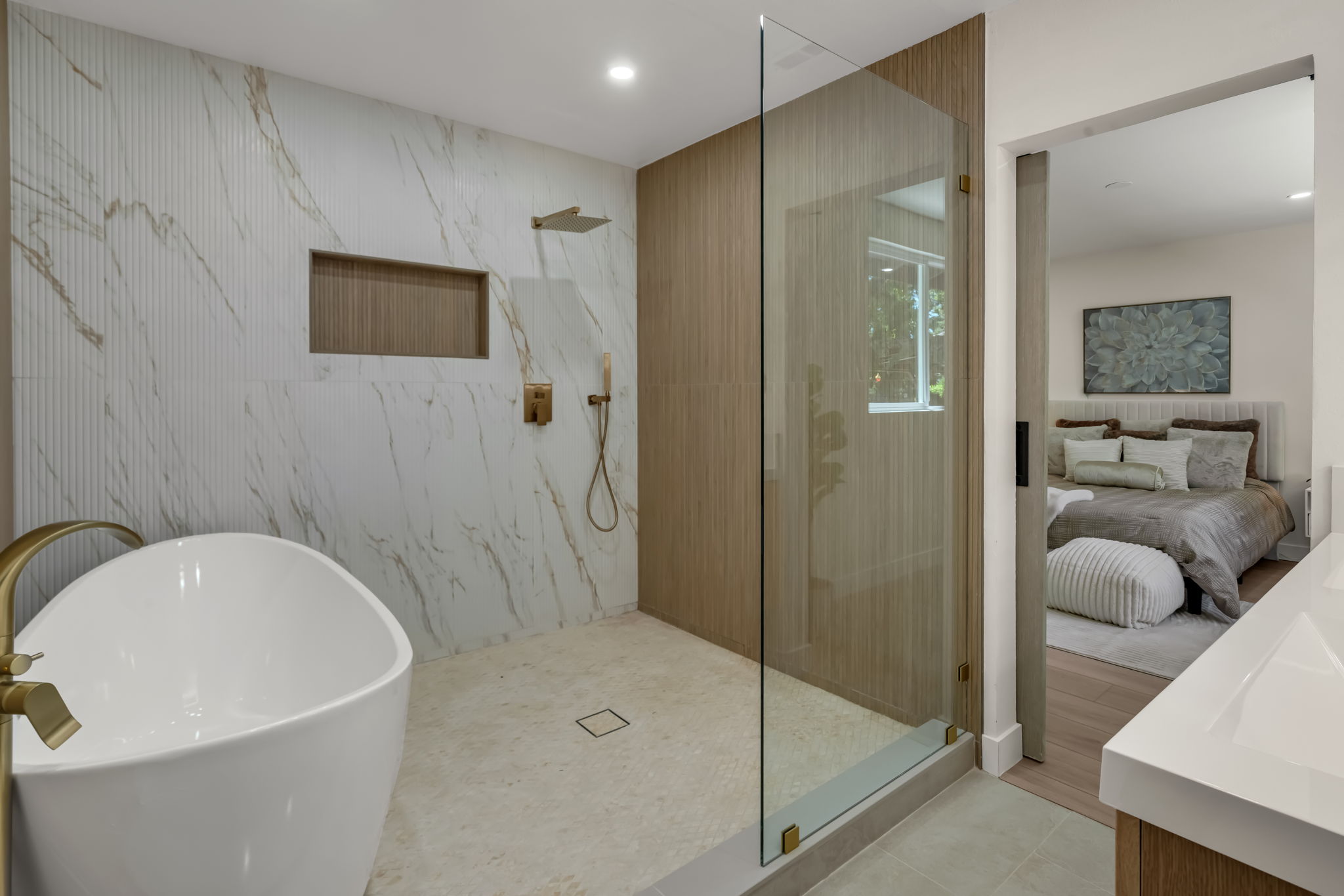 Rain shower with built-in niche and gold hardware