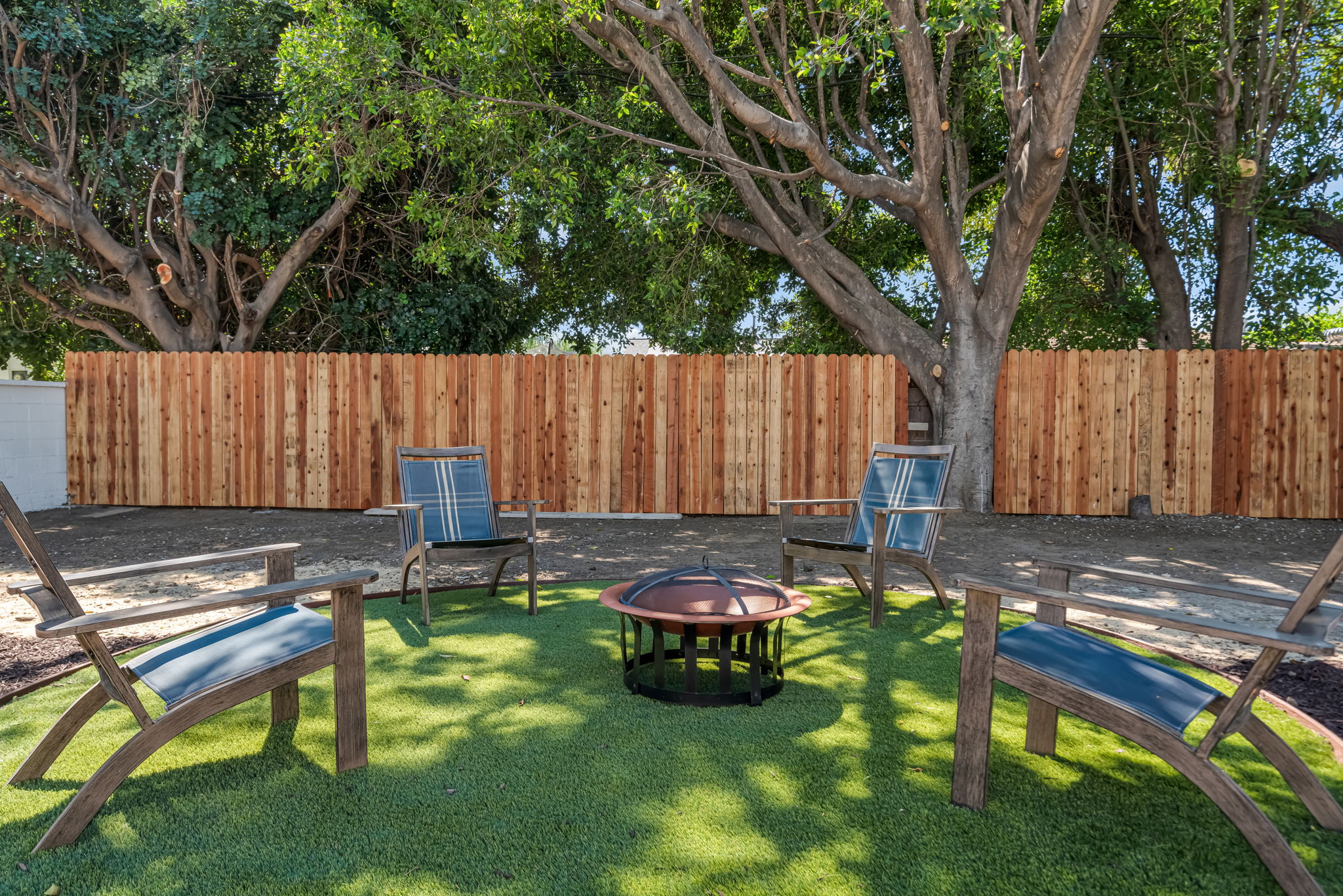Backyard fire pit — alternate angle with Adirondack chairs